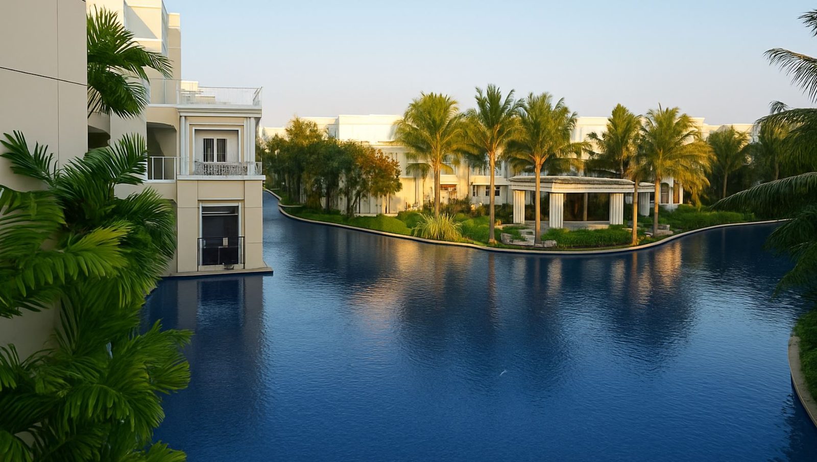 The lagoon canal at golden hour, winding past the residence buildings