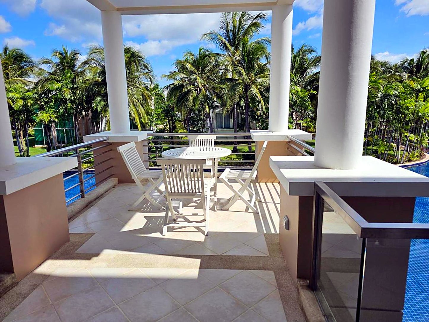 Upper-floor terrace looking out over the lagoon and gardens